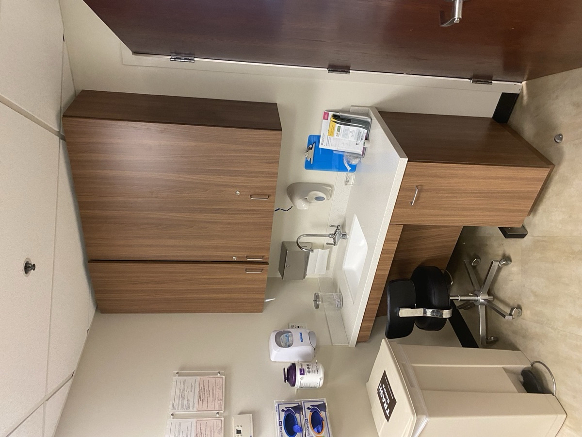 Completed imaging suite casework with wood-look cabinetry, solid-surface counter, and integrated sink, renovated by Selvaggi Built at Torrance Memorial